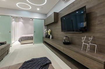 Image showing Modern white living studio with bedroom doors open