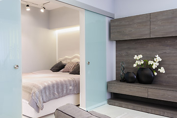 Image showing Modern white living studio with bedroom doors open