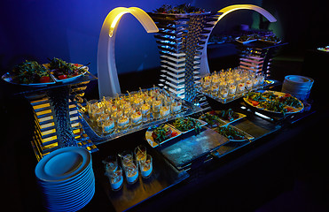 Image showing Beautifully decorated catering banquet table with different food snacks.