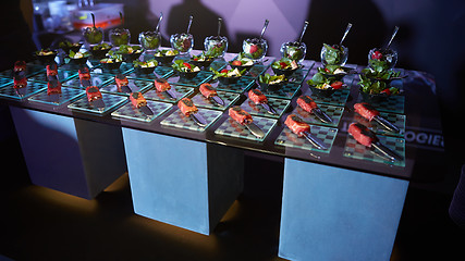 Image showing Beautifully decorated catering banquet table with different food snacks.