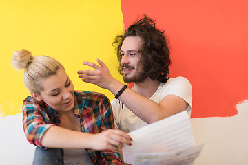 Image showing Happy young couple relaxing after painting