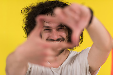 Image showing young man with funny hair over color background