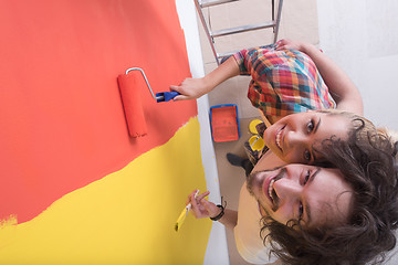 Image showing couple painting interior wall