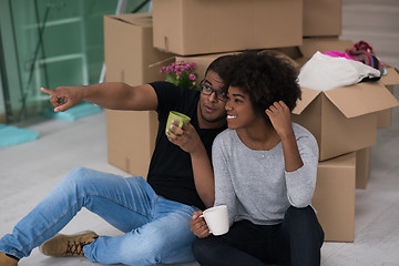 Image showing African American couple relaxing in new house