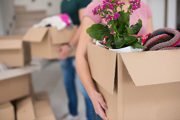 Image showing young couple moving into a new home