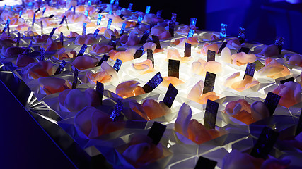 Image showing Beautifully decorated catering banquet table with different food snacks.