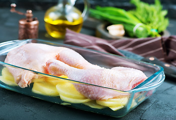 Image showing raw chicken legs and potato 