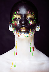 Image showing woman with creative makeup closeup like drops of colors, facepai