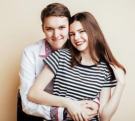 Image showing couple of happy smiling teenagers students, warm colors having a