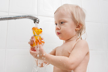 Image showing girl playing with water in the bath