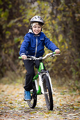 Image showing boy rides a bike