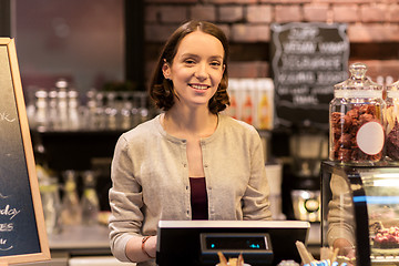 Image showing happy woman or barmaid with cashbox at cafe