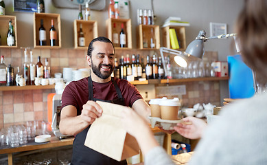 Image showing man or waiter serving customer at coffee shop