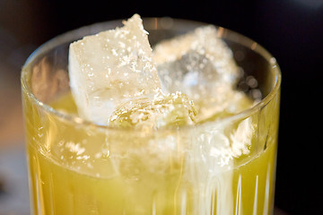 Image showing close up of glass with cocktail at bar