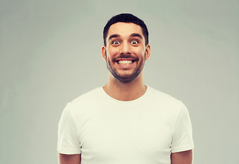 Image showing man with funny face over gray background