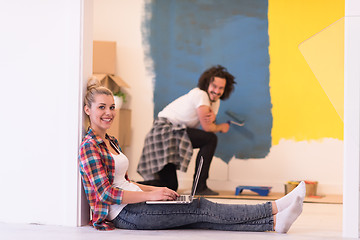 Image showing Happy couple doing home renovations