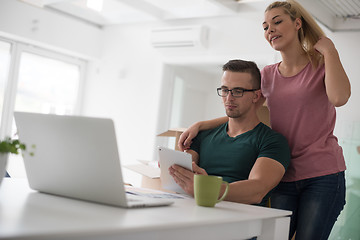 Image showing Young couple moving in a new home