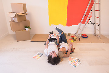 Image showing Happy young couple relaxing after painting