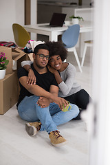 Image showing African American couple relaxing in new house