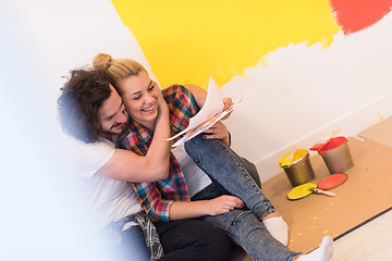 Image showing Happy young couple relaxing after painting