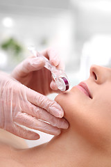 Image showing Mesotherapy microneedle, the woman at the beautician