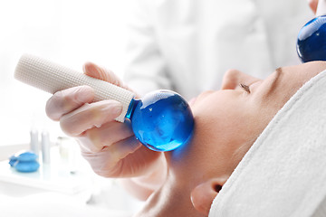 Image showing Massage the face with glass balls. Relaxation massage.