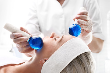 Image showing Massage the face with glass balls.