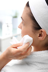 Image showing Cleansing facial skin, a woman in beauty salon 