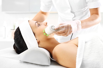 Image showing Light skin treatment, the woman in the beauty salon