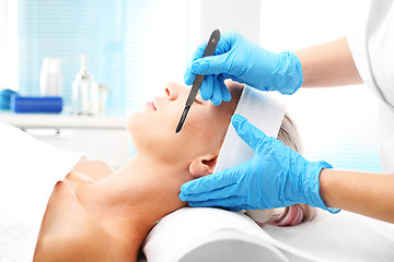 Image showing Dermabrasion manual using a surgical blade.