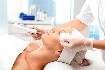 Image showing Peeling, ultrasound, woman at vanity