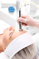 Image showing Relaxed woman during a microdermabrasion treatment in beauty salon