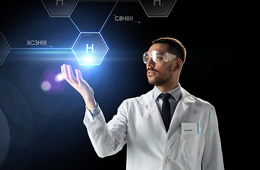 Image showing scientist in lab goggles chemical formula