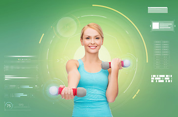 Image showing happy sporty woman with dumbbells flexing biceps