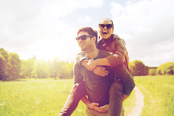 Image showing happy couple with backpacks having fun outdoors