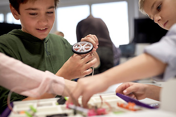 Image showing children with building kit at robotics school