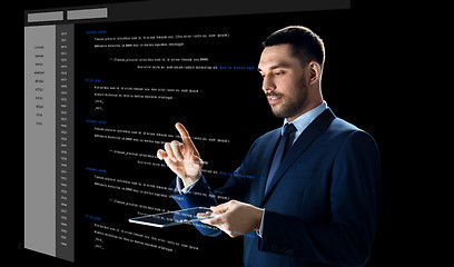 Image showing businessman with tablet pc and virtual coding