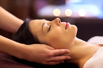 Image showing woman having face and head massage at spa