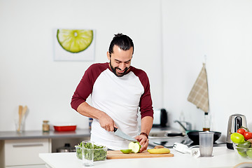 Image showing man with blender and fruit cooking at home kitchen