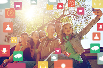 Image showing happy teenage friends taking selfie by smartphone