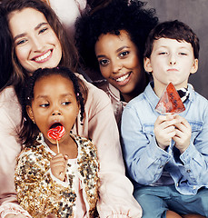 Image showing Lifestyle and people concept: young pretty diversity nations woman with different age children celebrating on birth day party together happy smiling, making selfie. African-american, asian and caucasi