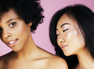 Image showing different nation girls with diversuty in skin, hair. Asian, african american cheerful emotional posing on pink background, woman day celebration, lifestyle people concept 