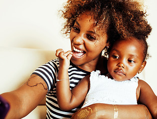 Image showing adorable sweet young afro-american mother with cute little daugh