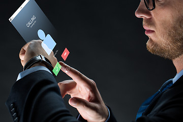 Image showing close up of businessman with smartwatch