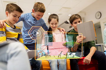 Image showing happy children with tablet pc and virtual animals