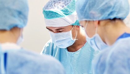 Image showing group of surgeons in operating room at hospital