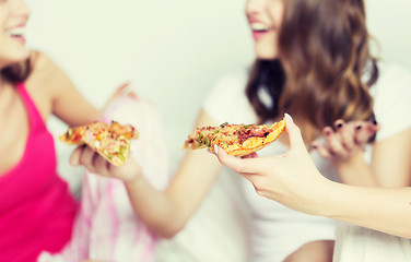 Image showing happy friends or teen girls eating pizza at home