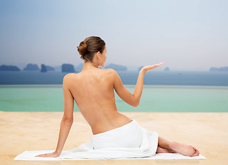 Image showing beautiful young woman in white towel with bare top