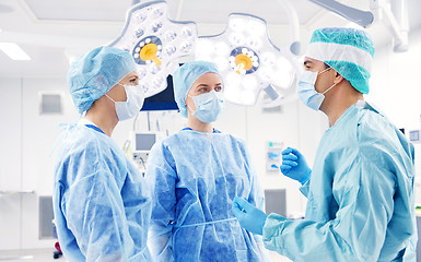 Image showing group of surgeons in operating room at hospital