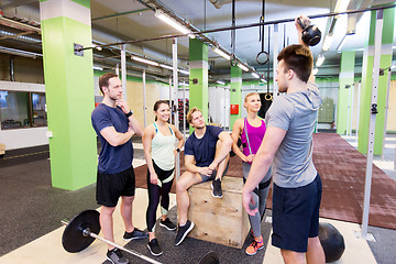 Image showing group of friends with sports equipment in gym